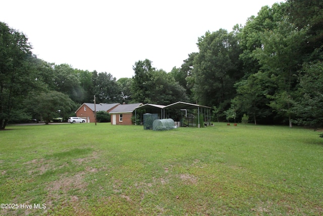 1317 Worthington Ln, Greenville, NC 27858 - view of green lawn with a detached carport