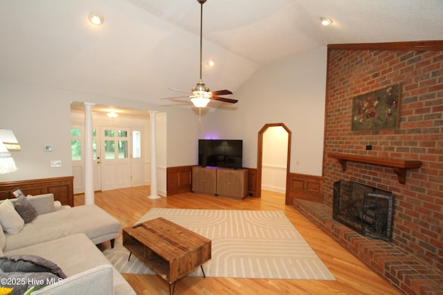 1317 Worthington Ln, Greenville, NC 27858 - living area with ornate columns, wainscoting, light wood finished floors, lofted ceiling, and ceiling fan