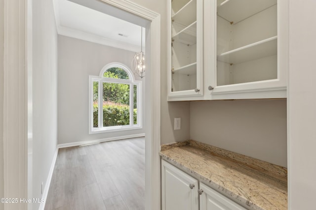 8807 Sawmill Creek Ln, Wilmington, NC 28411 - bar with a chandelier, wood finished floors, and baseboards