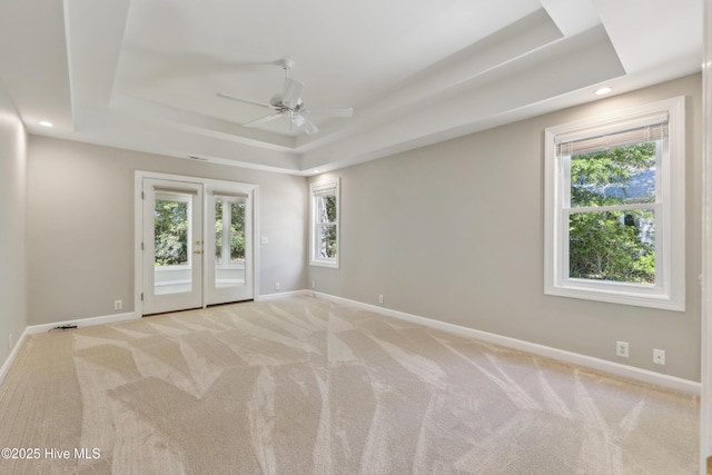 8807 Sawmill Creek Ln, Wilmington, NC 28411 - carpeted empty room featuring a raised ceiling, ceiling fan, plenty of natural light, baseboards, and recessed lighting