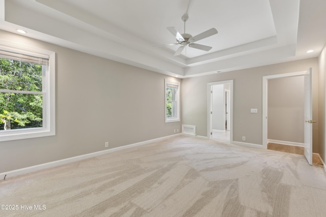 8807 Sawmill Creek Ln, Wilmington, NC 28411 - unfurnished bedroom with a tray ceiling, light carpet, baseboards, recessed lighting, and ceiling fan