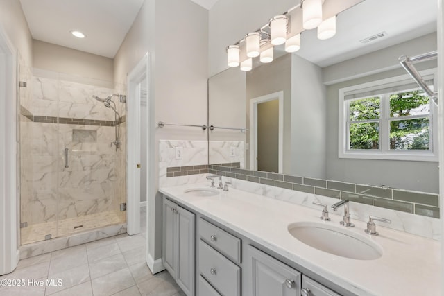 8807 Sawmill Creek Ln, Wilmington, NC 28411 - bathroom featuring a stall shower, double vanity, tile patterned flooring, and recessed lighting
