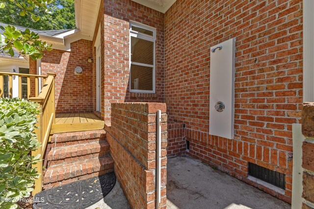 8807 Sawmill Creek Ln, Wilmington, NC 28411 - view of exterior entry with brick siding