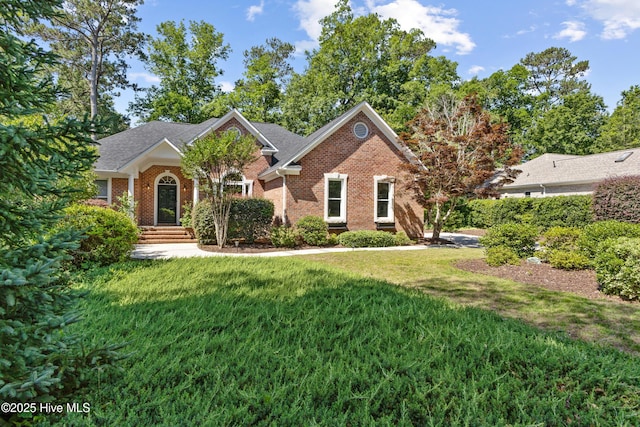 8807 Sawmill Creek Ln, Wilmington, NC 28411 - view of front of home with a front lawn and brick siding