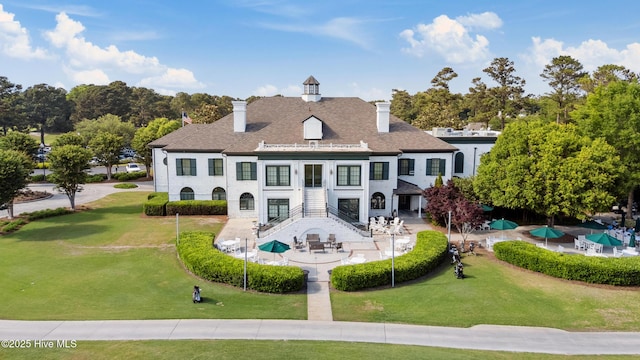 8807 Sawmill Creek Ln, Wilmington, NC 28411 - back of property with a lawn, a chimney, and stairs