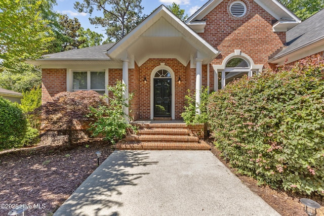 8807 Sawmill Creek Ln, Wilmington, NC 28411 - entrance to property with brick siding and a shingled roof