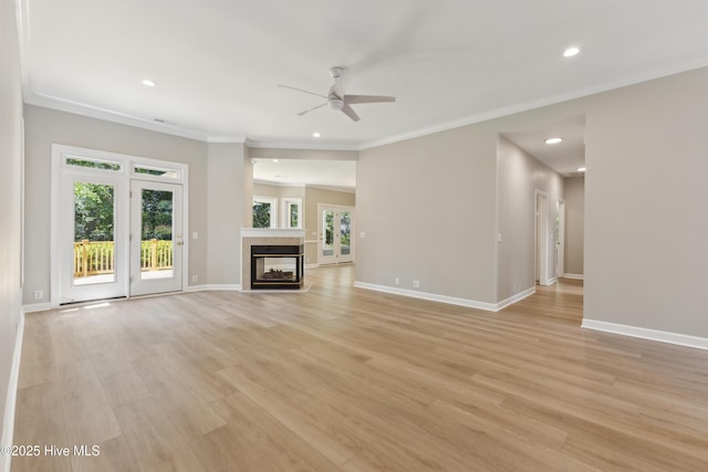 8807 Sawmill Creek Ln, Wilmington, NC 28411 - unfurnished living room with ceiling fan, recessed lighting, crown molding, light wood-style flooring, and baseboards