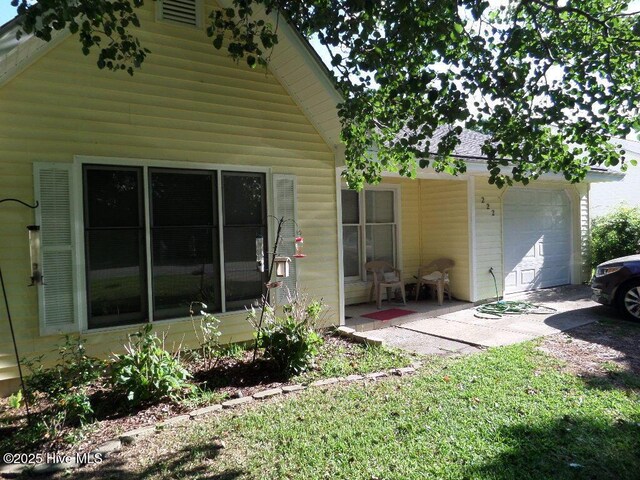 222 Rivershore Dr, New Bern, NC 28560 - rear view of property with a garage and a porch
