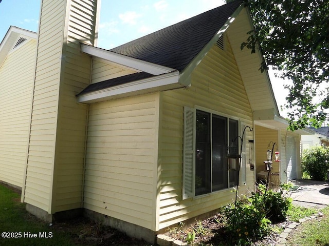 222 Rivershore Dr, New Bern, NC 28560 - view of home's exterior with a chimney and a shingled roof