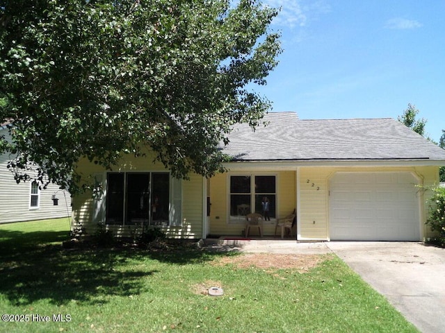 222 Rivershore Dr, New Bern, NC 28560 - view of front of property featuring a garage, concrete driveway, a front lawn, and roof with shingles