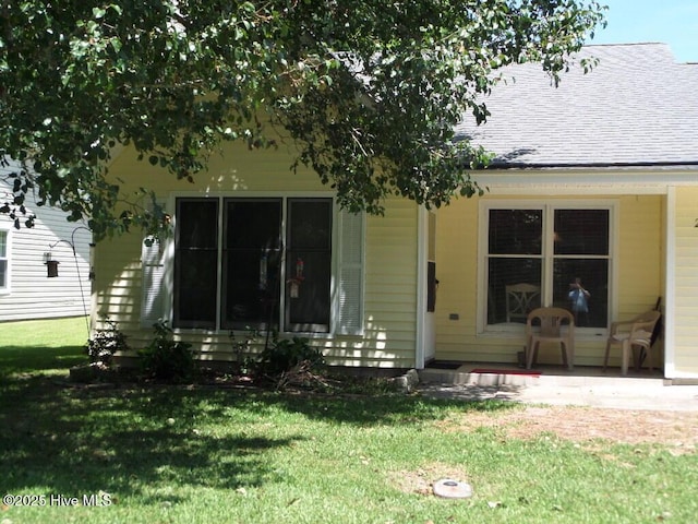 222 Rivershore Dr, New Bern, NC 28560 - back of house featuring a lawn and a shingled roof