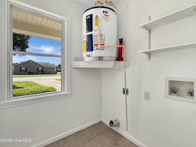 130 Summerfield St, Elizabeth City, NC 27909 - washroom featuring electric water heater, electric dryer hookup, tile patterned flooring, baseboards, and washer hookup