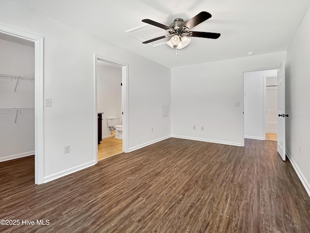130 Summerfield St, Elizabeth City, NC 27909 - unfurnished bedroom with dark wood-style floors, a spacious closet, a closet, baseboards, and ensuite bath