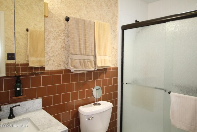 206 Stratford Rd, Havelock, NC 28532 - full bath with a shower stall, vanity, toilet, tile walls, and tasteful backsplash