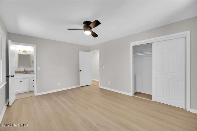 3417 Chalmers Dr, Wilmington, NC 28409 - unfurnished bedroom with light wood finished floors, baseboards, a sink, a closet, and ensuite bathroom