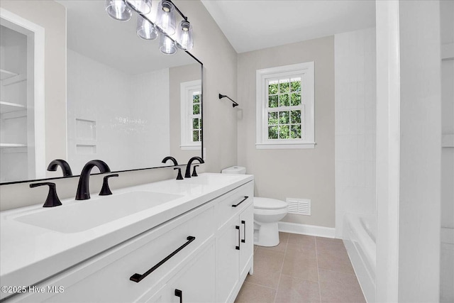 3417 Chalmers Dr, Wilmington, NC 28409 - bathroom featuring double vanity, toilet, baseboards, tile patterned floors, and  shower combination