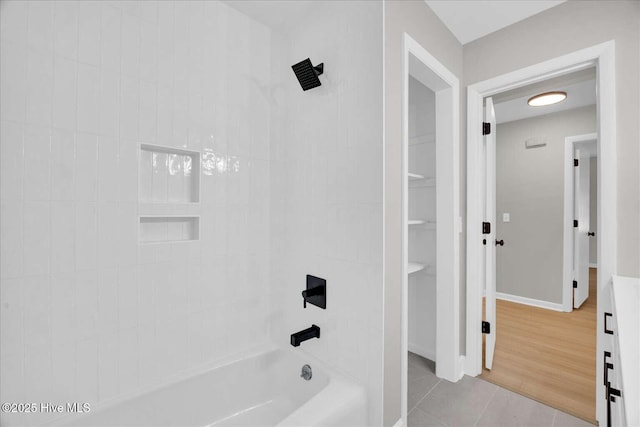 3417 Chalmers Dr, Wilmington, NC 28409 - bathroom featuring tile patterned flooring, shower / tub combination, and baseboards