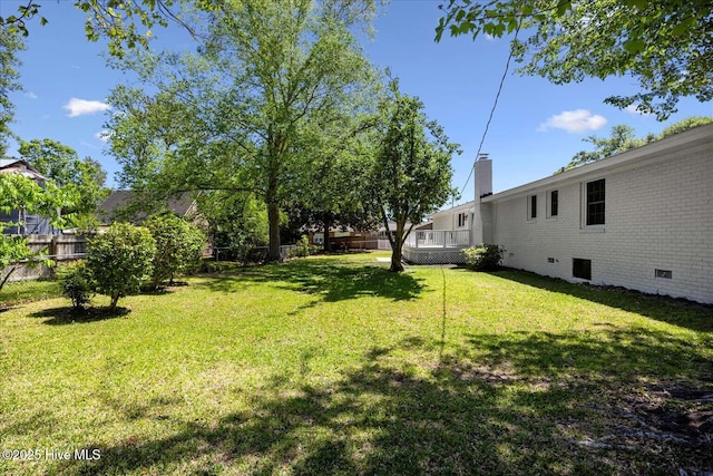 3417 Chalmers Dr, Wilmington, NC 28409 - view of yard with a wooden deck