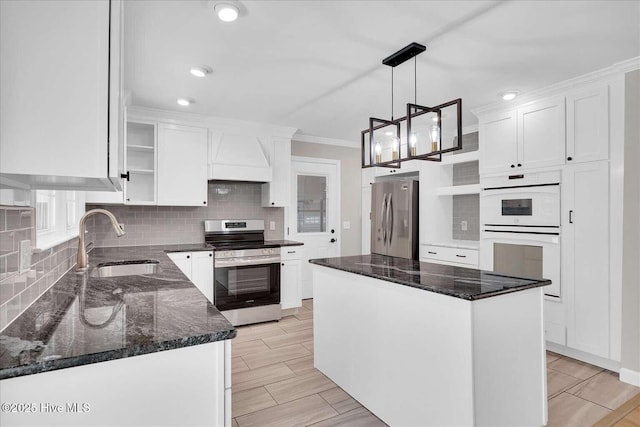 3417 Chalmers Dr, Wilmington, NC 28409 - kitchen with open shelves, stainless steel appliances, a sink, decorative backsplash, and crown molding
