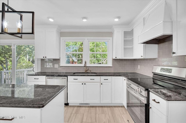 3417 Chalmers Dr, Wilmington, NC 28409 - kitchen featuring appliances with stainless steel finishes, a sink, custom range hood, crown molding, and white cabinets