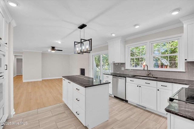 3417 Chalmers Dr, Wilmington, NC 28409 - kitchen featuring a sink, stainless steel dishwasher, crown molding, decorative backsplash, and wood tiled floors
