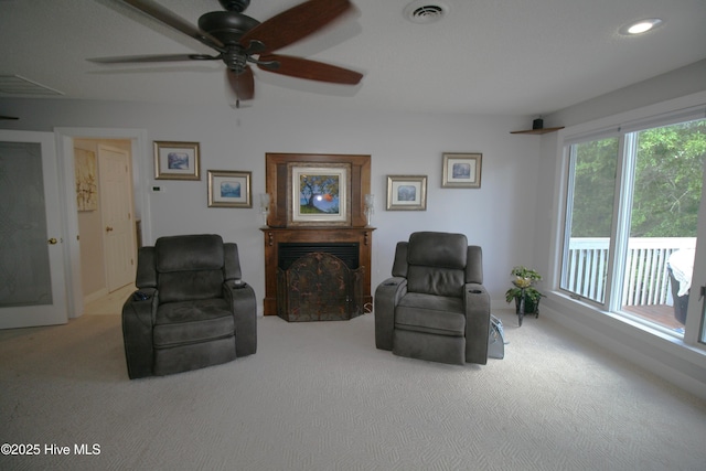 141 N River Rd, Plymouth, NC 27962 - living area with carpet floors, a fireplace, a ceiling fan, and recessed lighting
