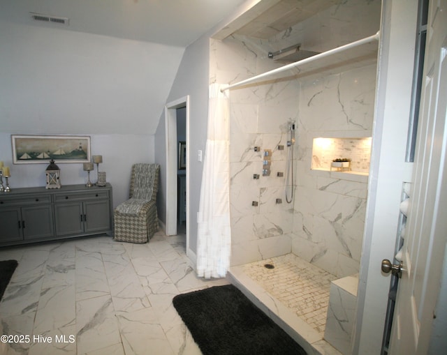 141 N River Rd, Plymouth, NC 27962 - bathroom featuring marble look tiles, a marble finish shower, vaulted ceiling, and vanity