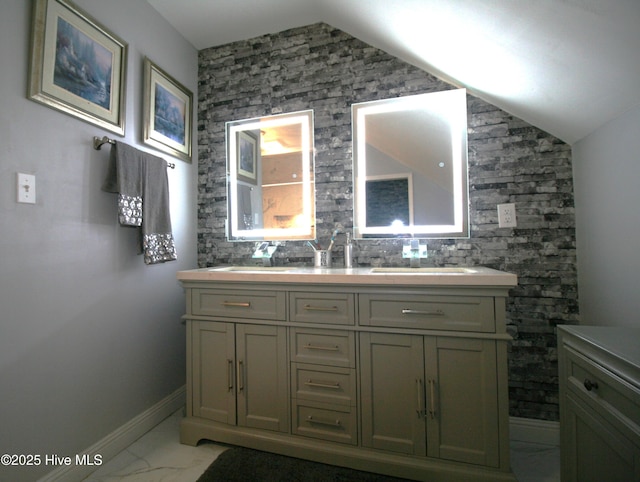 141 N River Rd, Plymouth, NC 27962 - bathroom featuring marble look tiles, double vanity, baseboards, and lofted ceiling