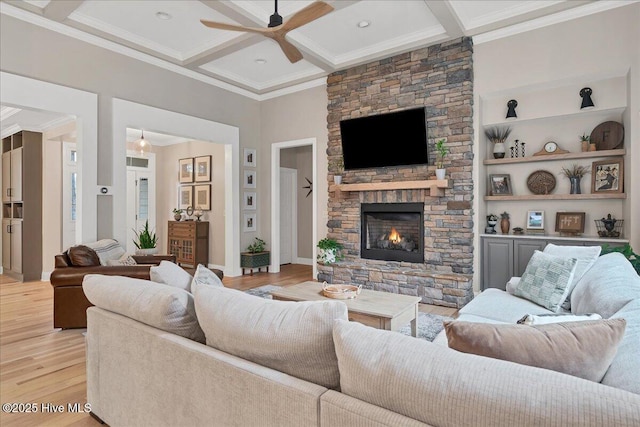 42 Spearhead Dr, Whispering Pines, NC 28327 - living area featuring a ceiling fan, ornamental molding, a fireplace, light wood-type flooring, and beam ceiling