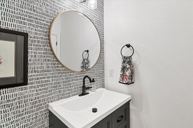 42 Spearhead Dr, Whispering Pines, NC 28327 - bathroom featuring vanity and tasteful backsplash