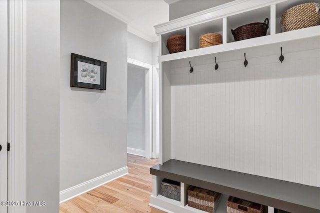 42 Spearhead Dr, Whispering Pines, NC 28327 - mudroom featuring light wood-type flooring, baseboards, and crown molding