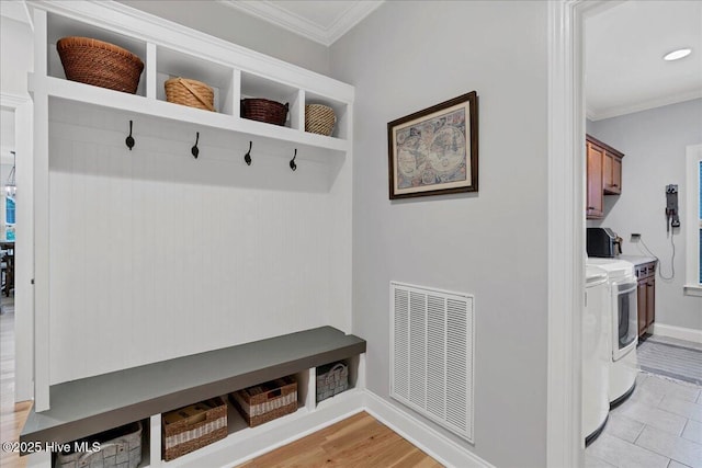 42 Spearhead Dr, Whispering Pines, NC 28327 - mudroom featuring washer / clothes dryer, ornamental molding, and baseboards