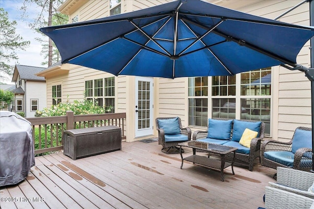 42 Spearhead Dr, Whispering Pines, NC 28327 - wooden terrace with an outdoor hangout area and a grill