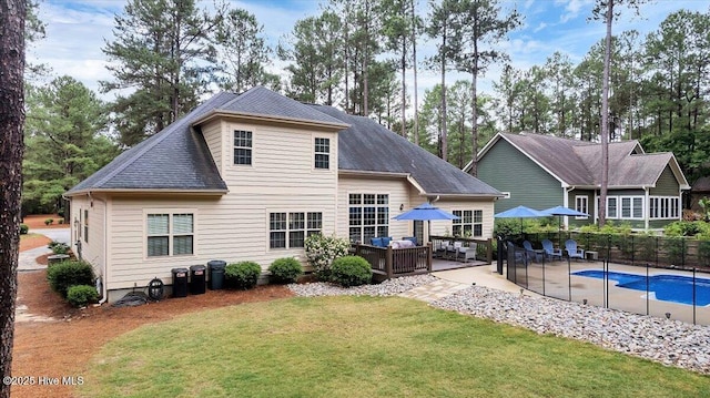 42 Spearhead Dr, Whispering Pines, NC 28327 - back of property featuring outdoor lounge area, a patio, and roof with shingles