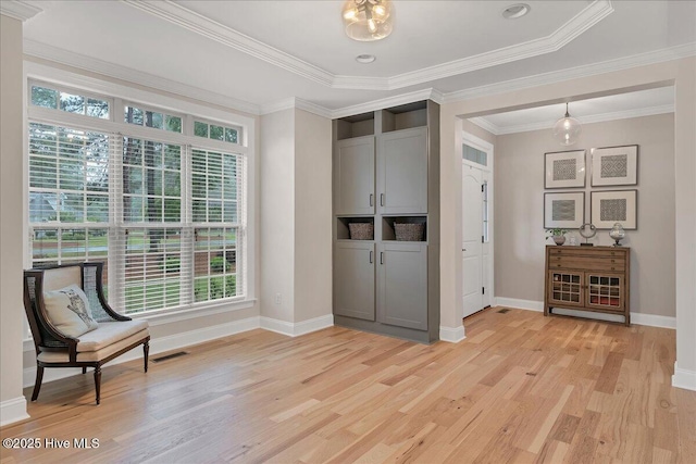 42 Spearhead Dr, Whispering Pines, NC 28327 - unfurnished room with plenty of natural light, light wood-style floors, baseboards, and ornamental molding