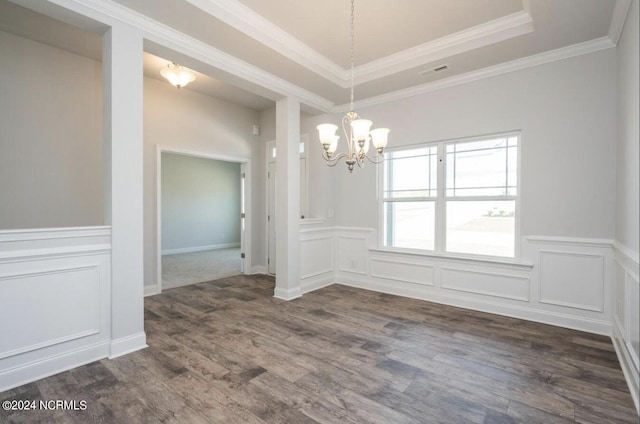 2958 Old Berwick St SW, Shallotte, NC 28470 - unfurnished dining area featuring a chandelier, dark wood-style floors, a wainscoted wall, a tray ceiling, and crown molding