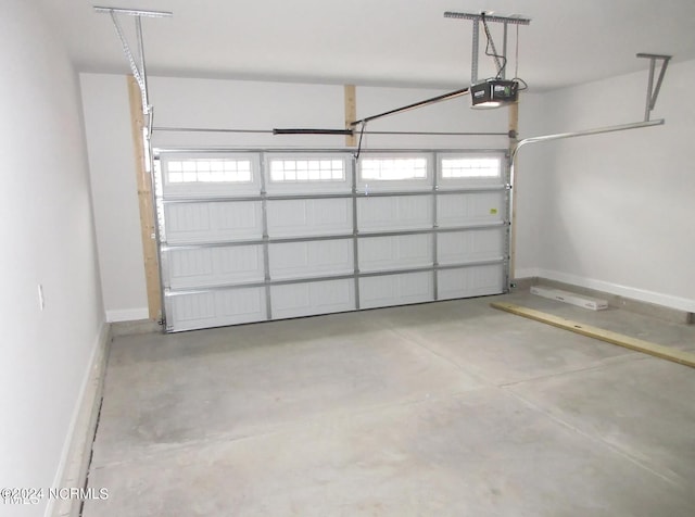 2958 Old Berwick St SW, Shallotte, NC 28470 - garage featuring a garage door opener and baseboards