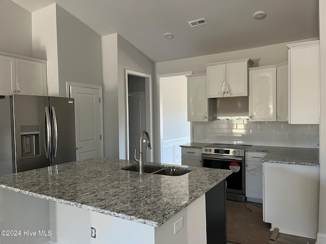 2958 Old Berwick St SW, Shallotte, NC 28470 - kitchen with stainless steel appliances, a sink, a kitchen island with sink, stone counters, and white cabinetry