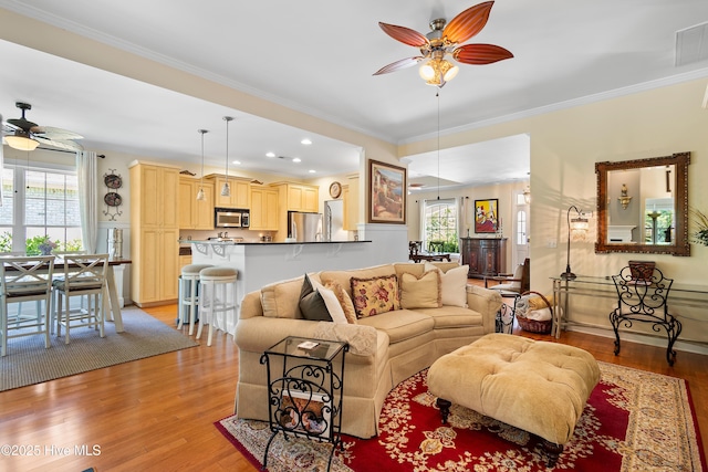 770 Creekway Cir SE, Bolivia, NC 28422 - living room featuring a ceiling fan, light wood-style floors, plenty of natural light, crown molding, and recessed lighting