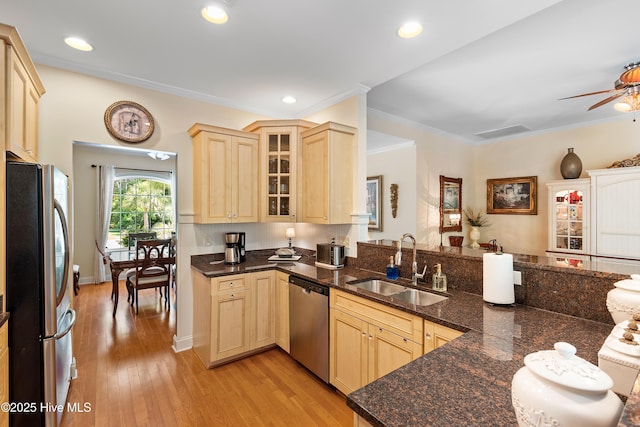 770 Creekway Cir SE, Bolivia, NC 28422 - kitchen featuring appliances with stainless steel finishes, light brown cabinetry, a sink, light wood-style flooring, and glass insert cabinets
