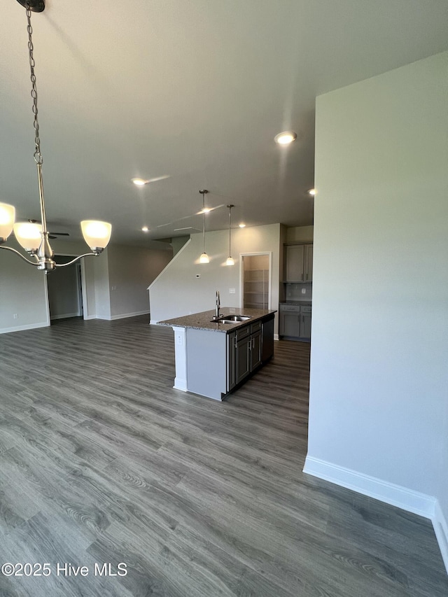 5022 Holly Hill Ct, Battleboro, NC 27809 - kitchen featuring a sink, open floor plan, baseboards, a chandelier, and recessed lighting