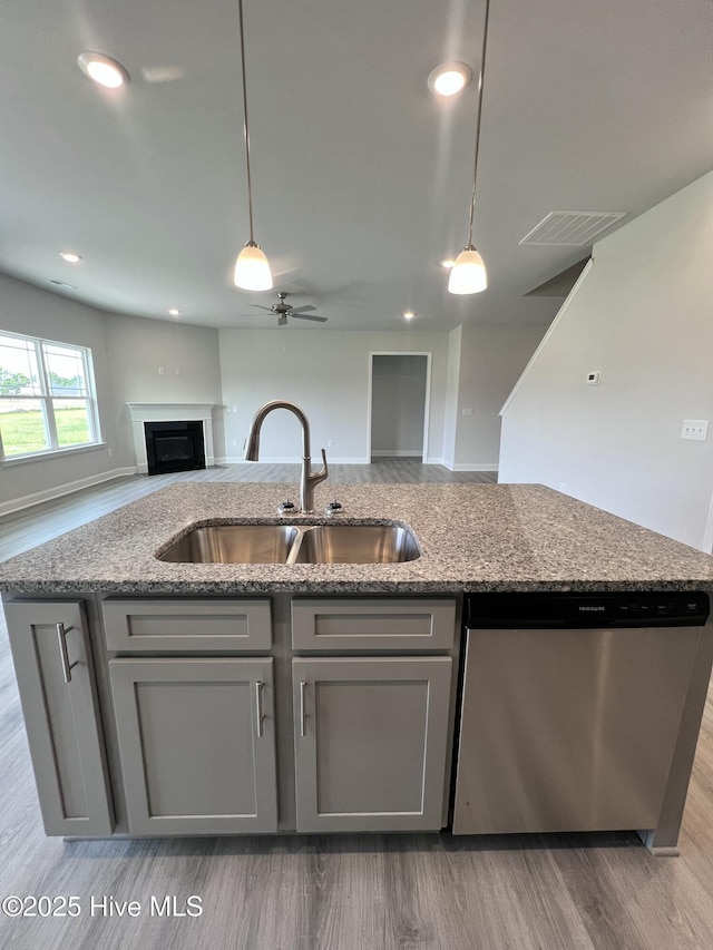 5022 Holly Hill Ct, Battleboro, NC 27809 - kitchen with dishwasher, a sink, gray cabinets, open floor plan, and ceiling fan