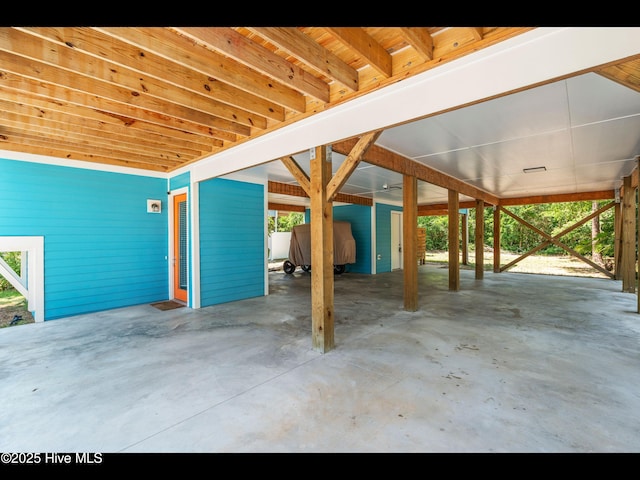 119 NE 27th St, Oak Island, NC 28465 - view of patio / terrace featuring a carport