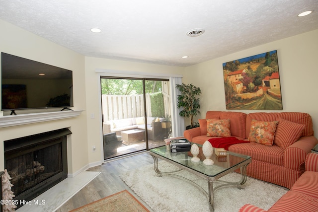 940 Linden Rd Unit 19, Pinehurst, NC 28374 - living area featuring wood finished floors, recessed lighting, a fireplace, and baseboards