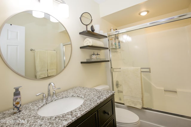 940 Linden Rd Unit 19, Pinehurst, NC 28374 - full bathroom featuring toilet, vanity, and bath / shower combo with glass door