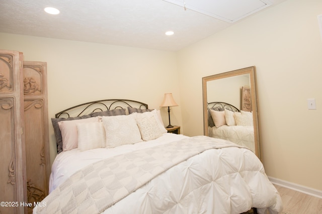 940 Linden Rd Unit 19, Pinehurst, NC 28374 - bedroom featuring light wood finished floors, baseboards, and recessed lighting