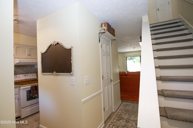 940 Linden Rd Unit 19, Pinehurst, NC 28374 - staircase with a textured ceiling