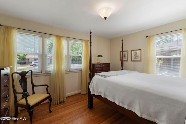 1606 Palm St, Goldsboro, NC 27530 - bedroom featuring light wood-type flooring, multiple windows, and baseboards
