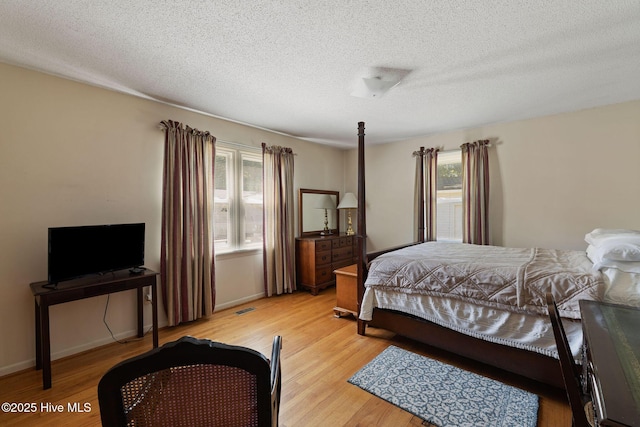 1606 Palm St, Goldsboro, NC 27530 - bedroom featuring light wood-type flooring and a textured ceiling