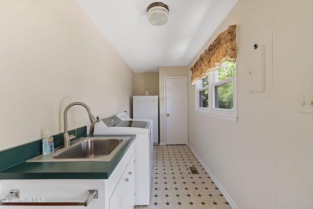 1606 Palm St, Goldsboro, NC 27530 - washroom featuring light floors, cabinet space, baseboards, and washer and clothes dryer